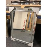 An all glass rectangular mirror