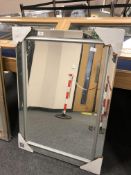 An all glass rectangular mirror