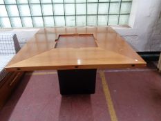 A contemporary extending square dining room table.