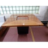 A contemporary extending square dining room table.