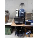 Two HP printers together with a shopping trolley containing metal bin and fan,