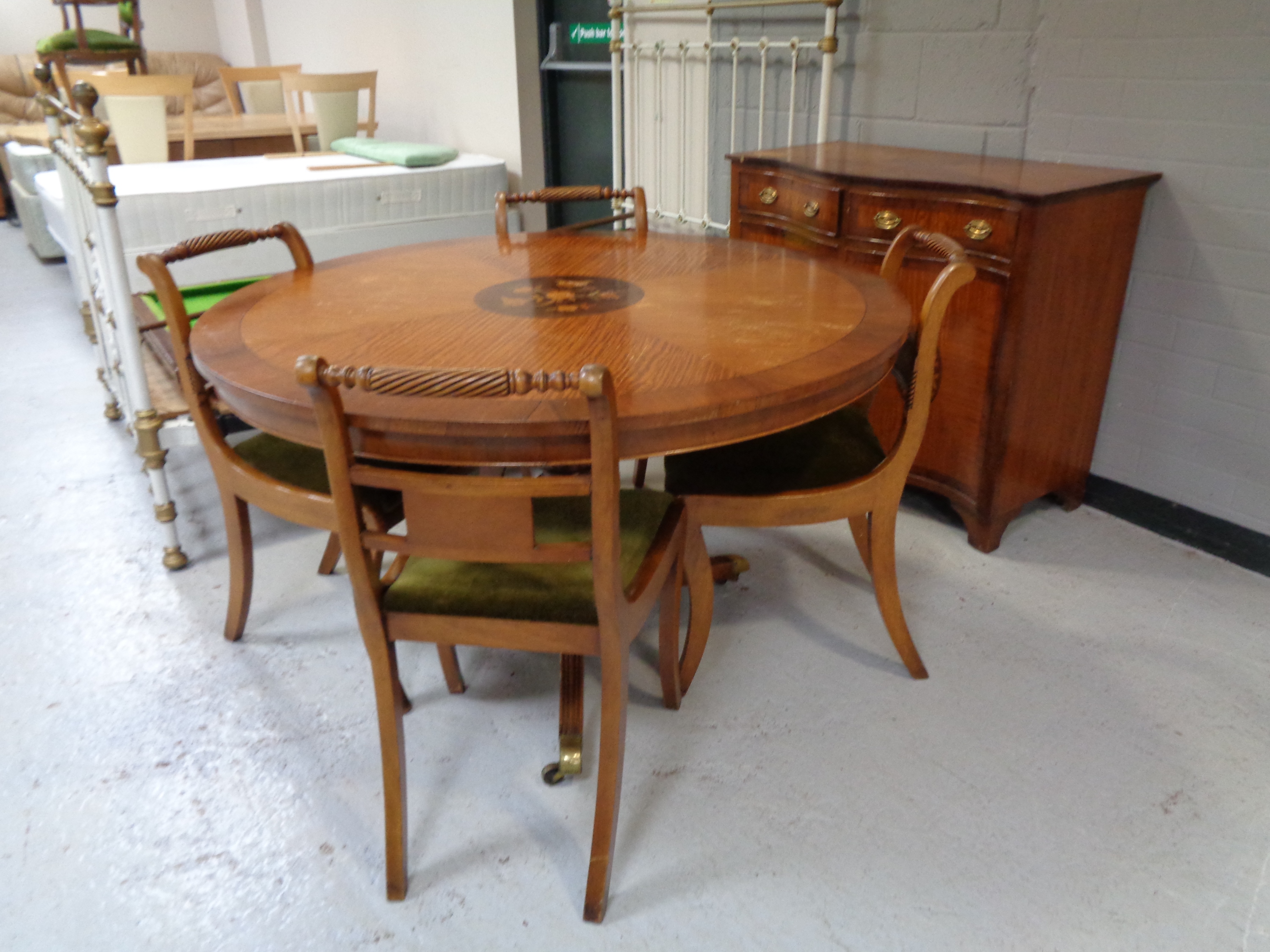 A six piece mahogany and cherry wood dining room suite - circular table,