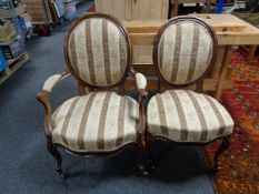 An antique walnut scroll armchair together with matching dining chair in Regency stripe fabric