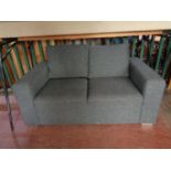 A two seater settee in grey fabric