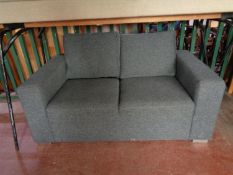 A two seater settee in grey fabric