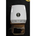 Two boxed Kimberley Clarke hand towel dispensers and a box of loft legs
