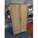 An early twentieth century pine double door cabinet