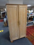 An early twentieth century pine double door cabinet