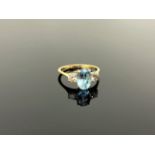 An 18ct gold two stone diamond and aquamarine ring, size M/N, approximately 0.4ct diamonds.