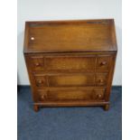A 1930's bureau fitted with three drawers
