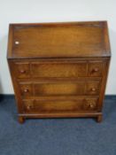 A 1930's bureau fitted with three drawers