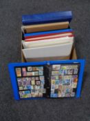 A box of folders of stamps of the world,