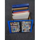 A box of folders of stamps of the world,