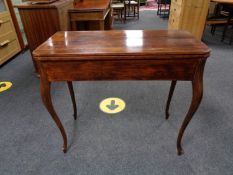 A late nineteenth century mahogany turn over top tea table on cabriole legs