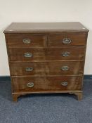 A George III mahogany five drawer chest with metal drop handles