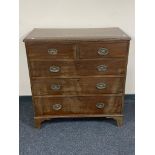 A George III mahogany five drawer chest with metal drop handles