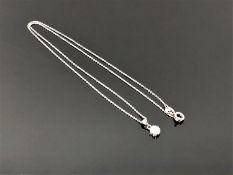 An 18ct white gold diamond set pendant on chain