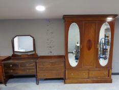 A three piece inlaid mahogany Edwardian bedroom suite