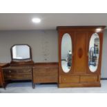 A three piece inlaid mahogany Edwardian bedroom suite