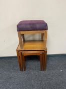 A nest of three mid century teak tables together with an Myer footstool