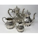 An ornate silver plated four piece tea service