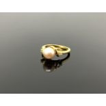 A 10ct gold diamond and cultured pearl ring,