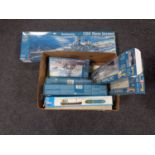 A box of seven boxed Revell modelling kits of boats