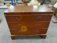 A Victorian mahogany three drawer chest on bracket feet