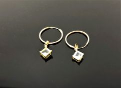 A pair of gold aquamarine earrings