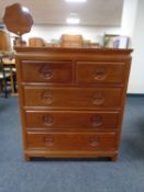 An oriental style five drawer chest