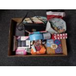 A box of beauty products, gift sets, hand bags,