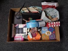 A box of beauty products, gift sets, hand bags,