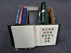 A box of various stamp albums, Great Britain first day covers, World stamps etc.