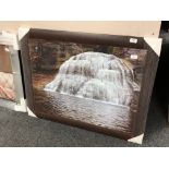 A framed glitter picture depicting a waterfall