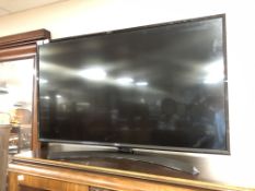An LG 43" LCD TV with lead and remote