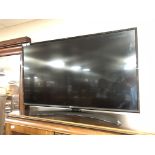 An LG 43" LCD TV with lead and remote