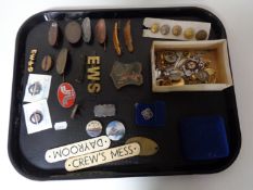 A tray of assorted enamelled badges, naval badges and buttons,