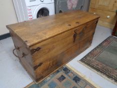 An antique oak metal bound shipping trunk CONDITION REPORT: Locked and without a key.