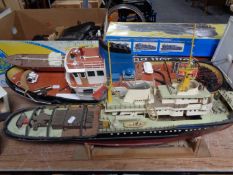 A charger fishing trawler together with two further model boats