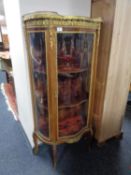 A continental glazed serpentine front vitrine with marble top and ormolu mounts CONDITION
