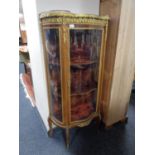 A continental glazed serpentine front vitrine with marble top and ormolu mounts CONDITION