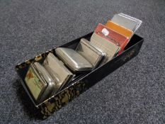 A box of assorted cigarette cases