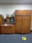 An early twentieth century walnut wardrobe and matching dressing table