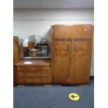 An early twentieth century walnut wardrobe and matching dressing table