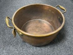 An antique copper brass handled pan