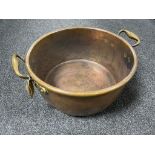 An antique copper brass handled pan