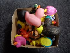Two boxes of rubber ducks, wicker waste bin, pictures,