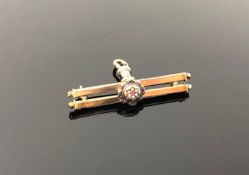 A Victorian 9ct gold ruby and seed pearl bar brooch CONDITION REPORT: 5.