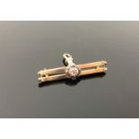 A Victorian 9ct gold ruby and seed pearl bar brooch CONDITION REPORT: 5.