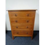 A twentieth century oak four drawer chest